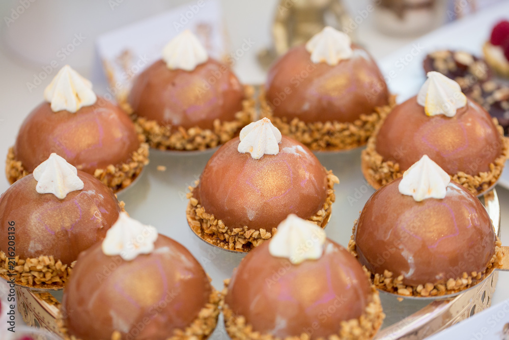 Close up of mini chocolate cakes with nuts Close up of mini chocolate cakes with nuts