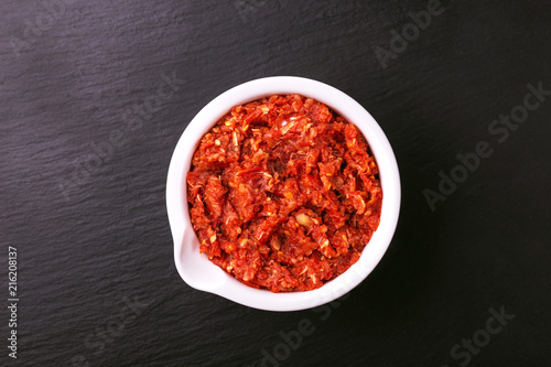 Traditional Maghrebi hot chili pepper sauce paste harissa. adjika