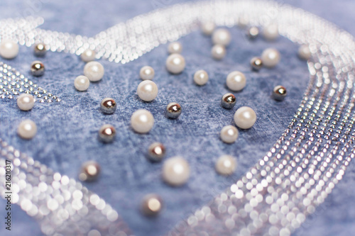 The clothes are encrusted with rhinestones, pearls and beads. Denim fabric. Decor on the dress.