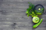 Background with various green vegetables and greens