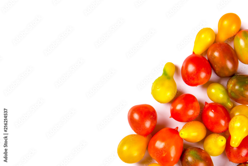 various colorful tomatoes isolated on white background