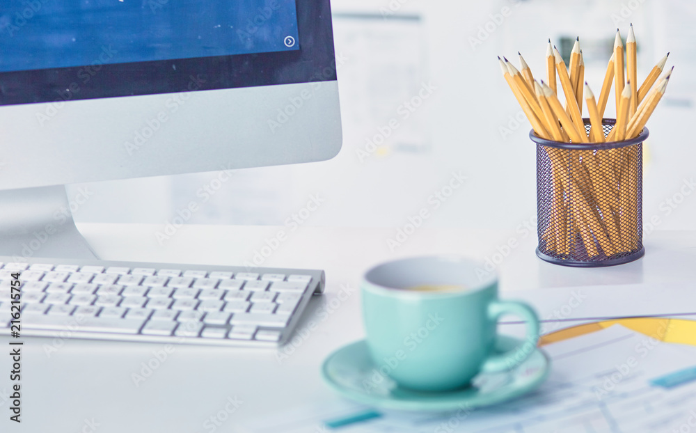 A cup of coffee on the office table A cup of coffee on the office table