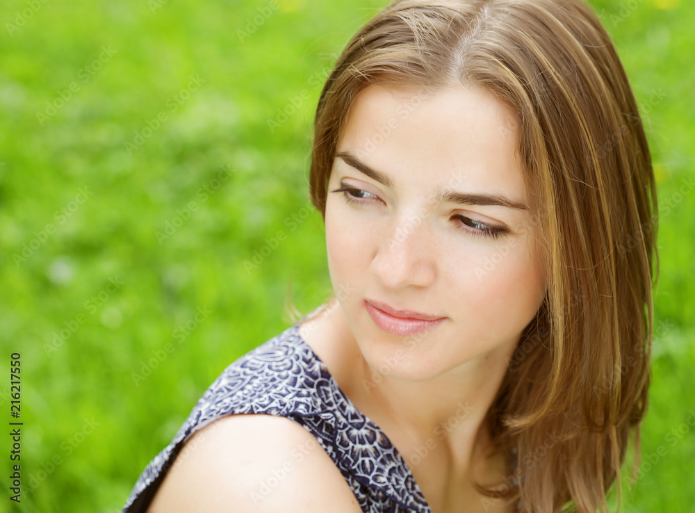 young woman in dress relaxing in garden young woman in dress relaxing in garden