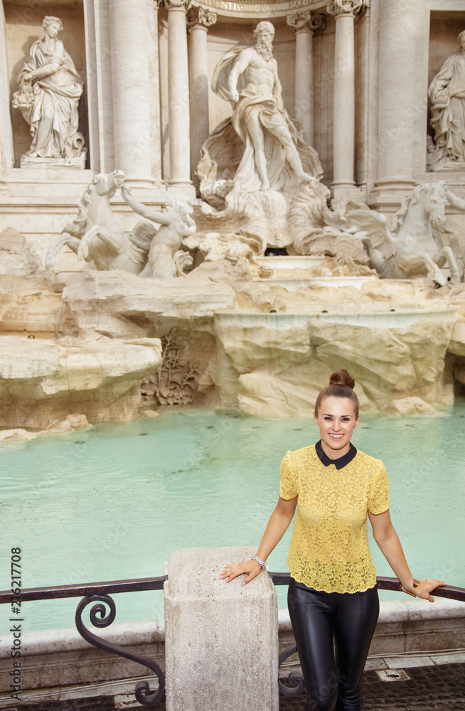 Obraz premium Portrait of happy stylish woman in yellow blouse in Rome, Italy