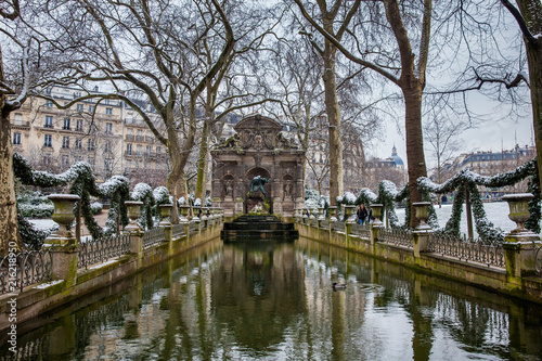 Medici Fountain at the Luxembourg Palace garden in a freezing winter day day just before spring