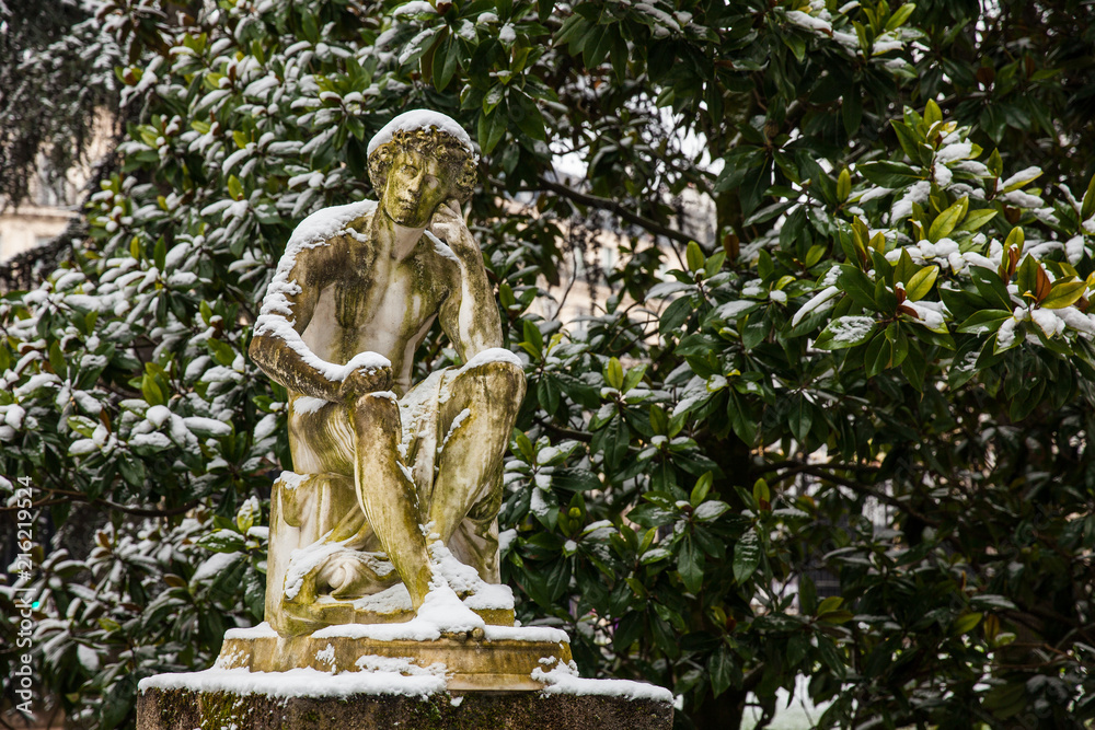 Thinking man statue at the Luxembourg Palace garden in a freezing winter day day just before spring Thinking man statue at the Luxembourg Palace garden in a freezing winter day day just before spring