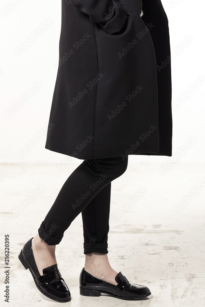 woman wearing black enamel shoes isolated white. Stock Photo | Adobe Stock
