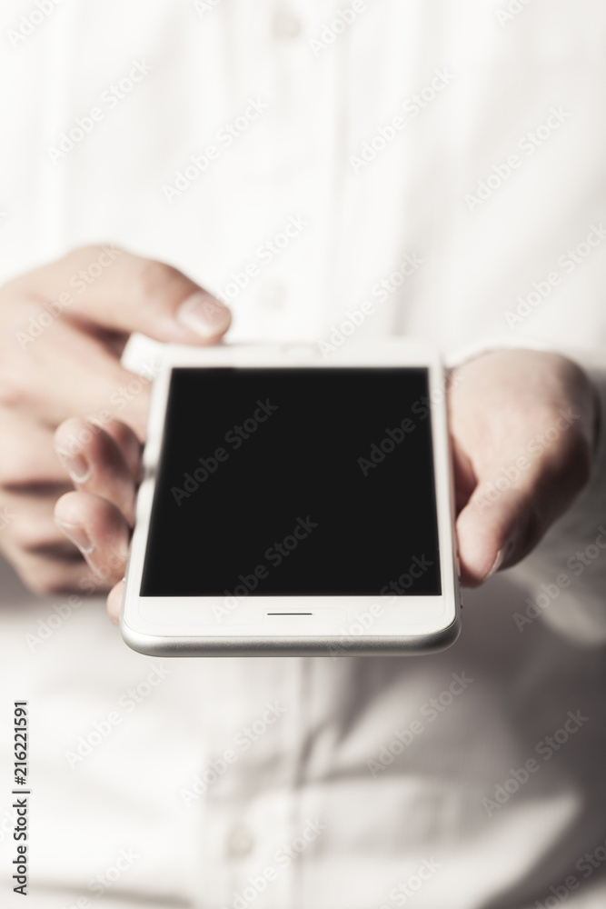 business man hand hold a mobile phone on the white background. business man hand hold a mobile phone on the white background.