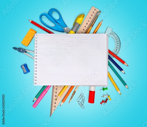 Colorful school supplies on background