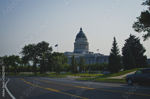 The side view of the salt lake city capitol on the hills along the road. 