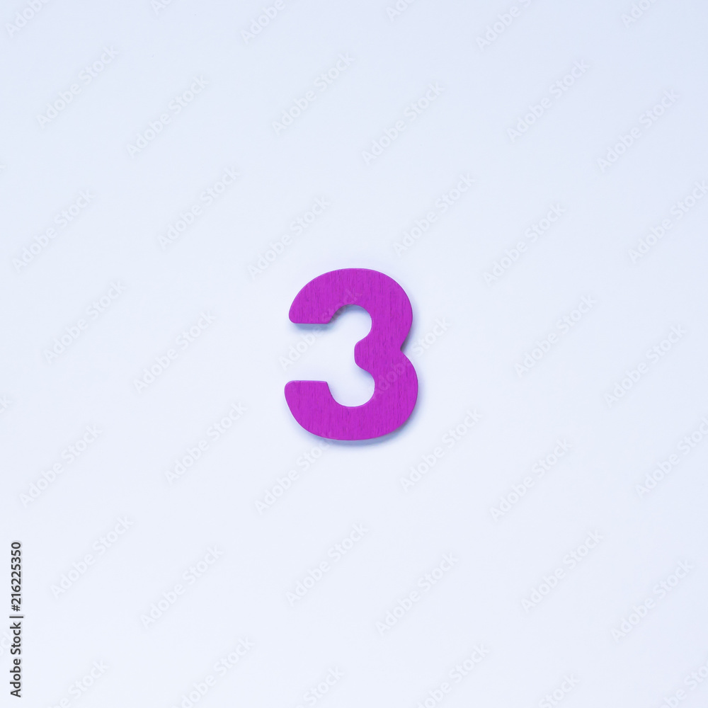 Wooden number 3 with purple color on white background. Wooden number 3 with purple color on white background.