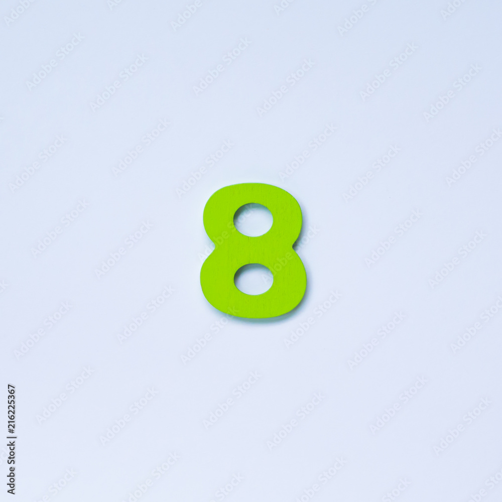 Wooden number 8 with green color on white background. Wooden number 8 with green color on white background.