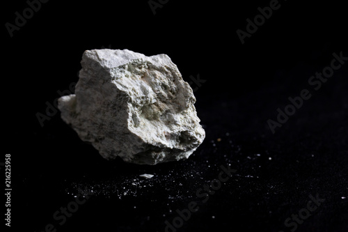 Kaolinite stone isolate on black background 