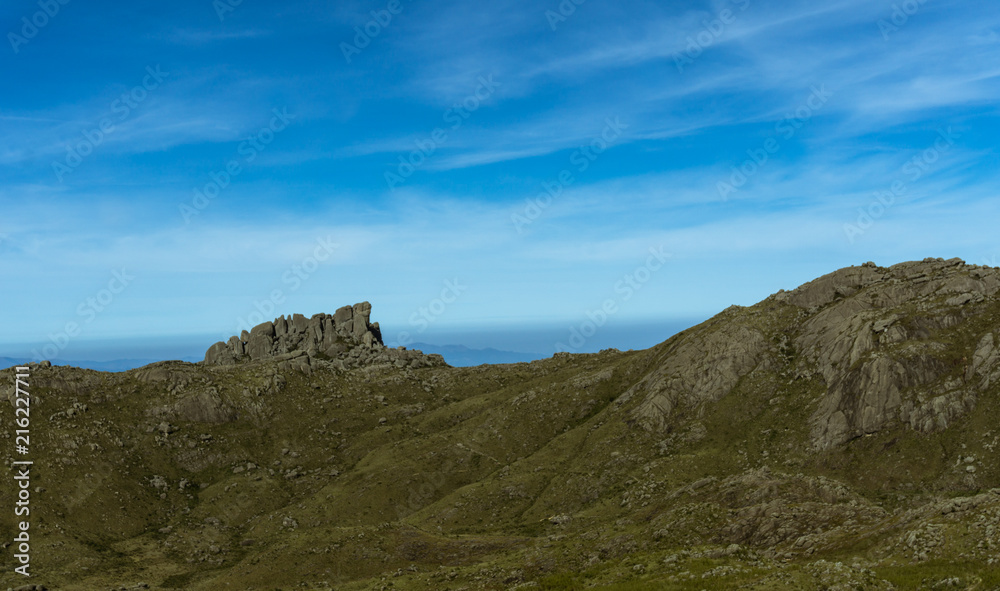 The details of the interesting relief of an expressive rocky mountain of nature preserved under the Brazilian blue sky