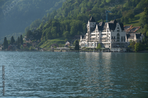 Large hotel by the water in the swiss alps