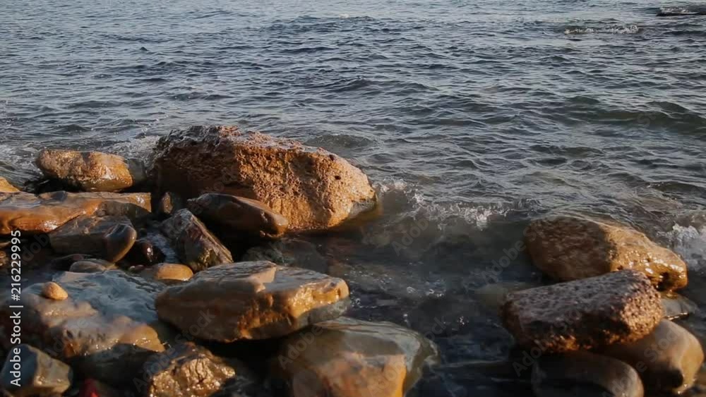 Sea waves are fighting against the rocks on the shore. Sea waves are fighting against the rocks on the shore.