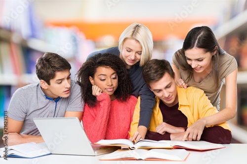 Four Young students studying subject on background