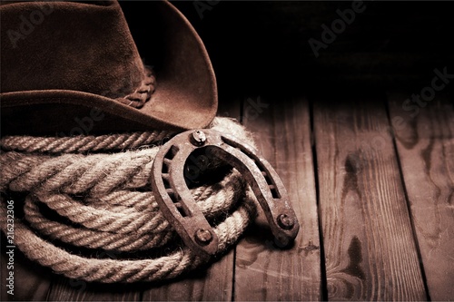 Photography Old horseshoe , lariat lasso and cowboy
