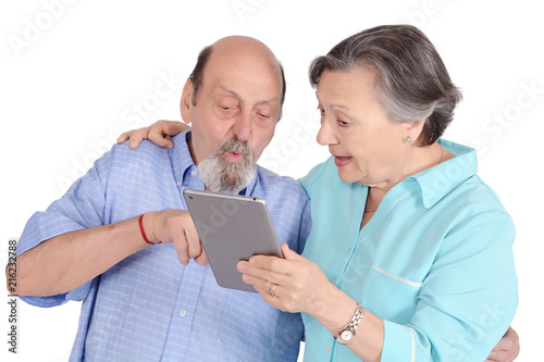Obraz na płótnie Shocked senior couple with tablet pc