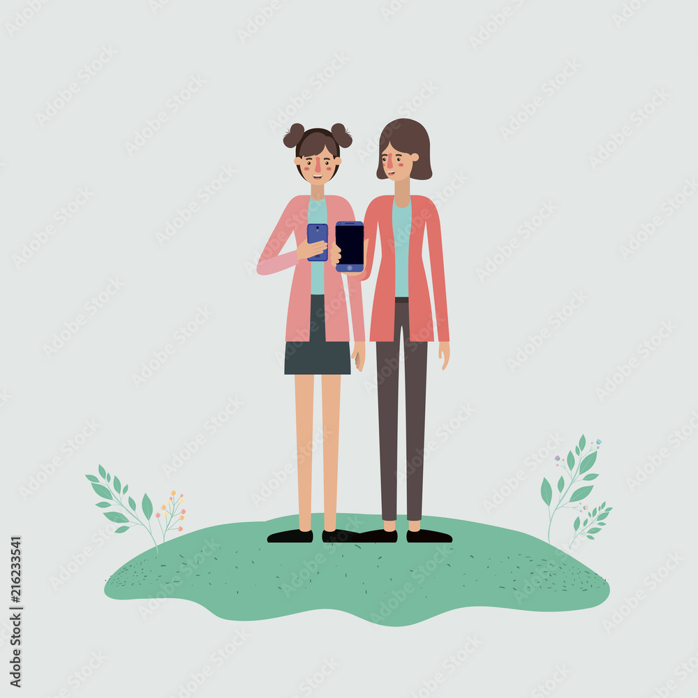 group of women using smartphone in the field group of women using smartphone in the field