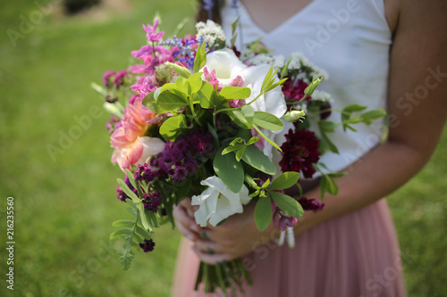 Bridesmaid in White Shirt and Pink Tulle Skirt Holding Bouquet Wedding Flower Arrangement with White  Pink  Fuchsia  and Green Flowers