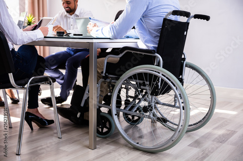 Disabled Businessman Sitting In Office