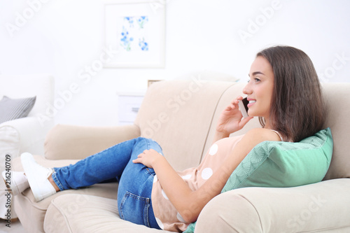 Young woman talking on phon...
