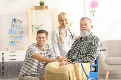 Caregiver with senior man a...