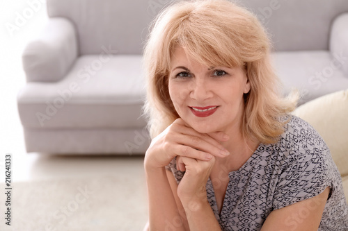 Portrait of beautiful mature woman resting at home