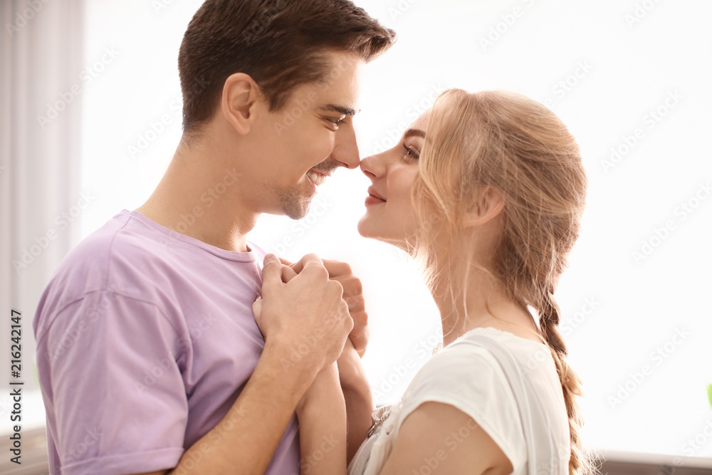 Cute young couple dancing indoors Cute young couple dancing indoors