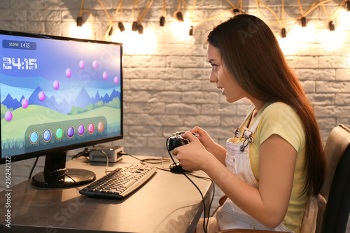 Young woman playing video g...