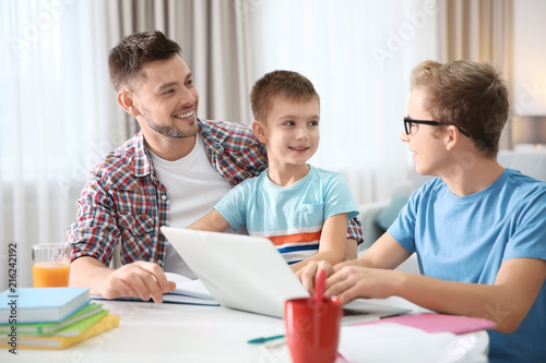 Children with father doing ...