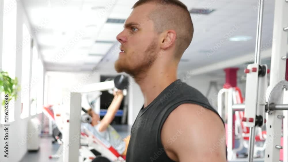 Bodybuilding - young man hard training in gym Bodybuilding - young man hard training in gym