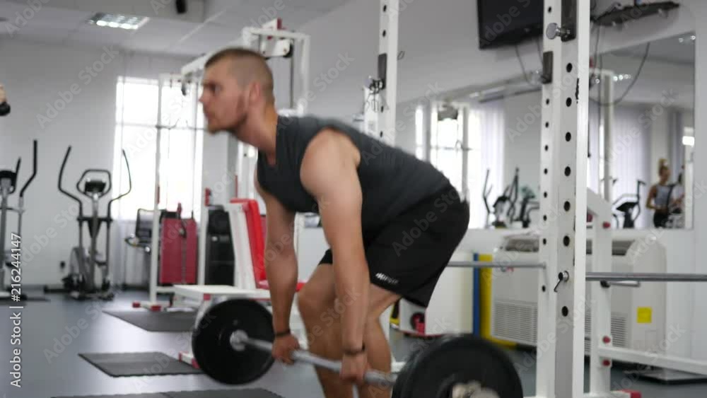 Bodybuilding - young man hard training in gym Bodybuilding - young man hard training in gym