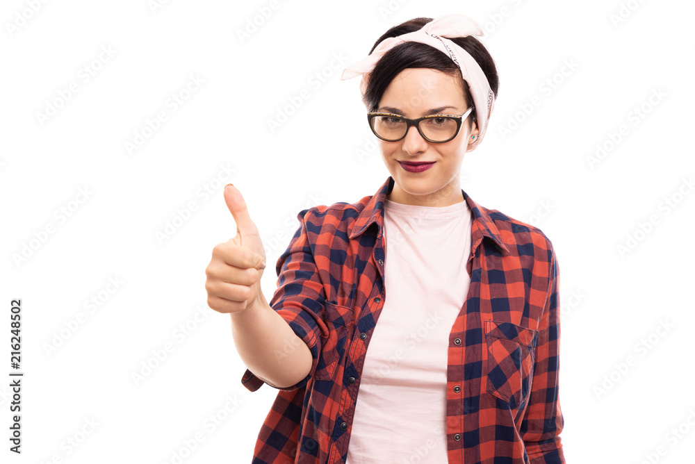 Pretty pin-up girl wearing glasses showing thumb up gesture. Pretty pin-up girl wearing glasses showing thumb up gesture.