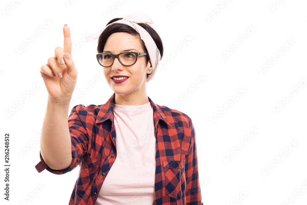 Young pretty pin-up girl wearing glasses pointing touchscreen. Young pretty pin-up girl wearing glasses pointing touchscreen.