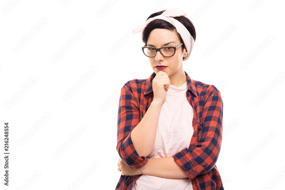 Young pretty pin-up girl wearing glasses showing reflecting gesture. Young pretty pin-up girl wearing glasses showing reflecting gesture.