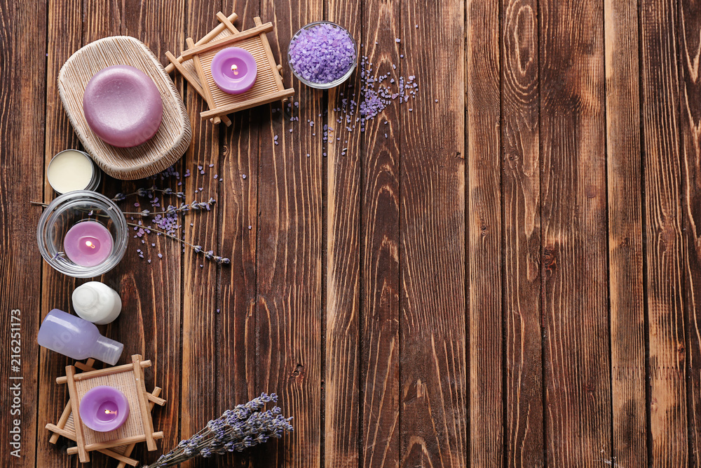 Spa composition with candles, sea salt and lavender on wooden background Spa composition with candles, sea salt and lavender on wooden background