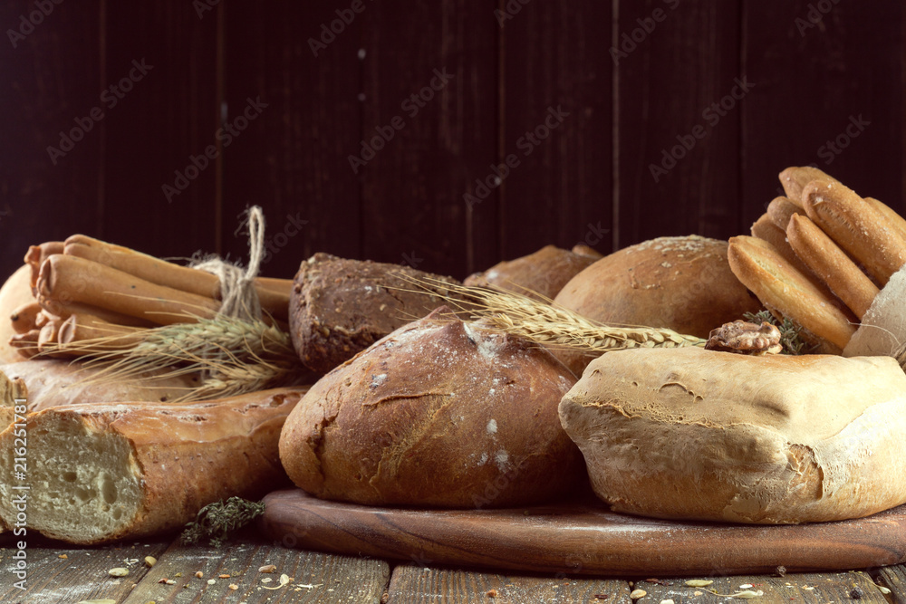 baked bread on wooden table background