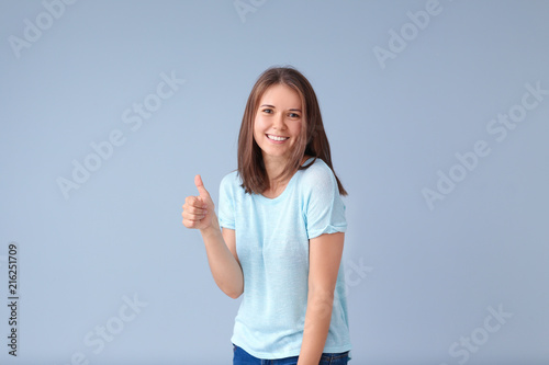 Beautiful young woman showi...