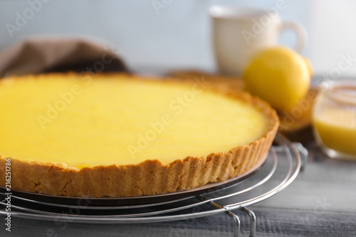 Tasty lemon pie on wooden table, closeup