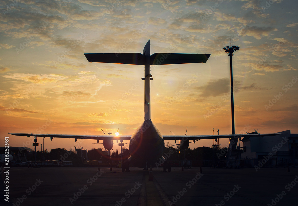 Airplane and sunset in airport 