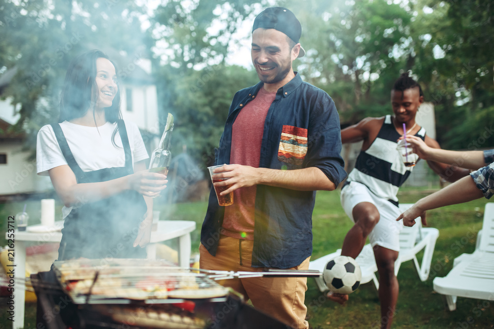 Group of friends making barbecue in the backyard. concept about good and positive mood with friends