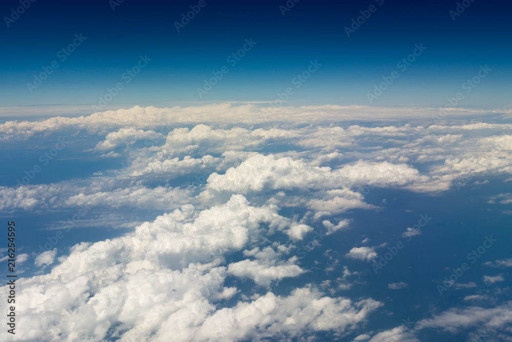 Thick white clouds from the airplane window Thick white clouds from the airplane window