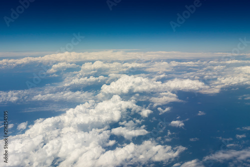Thick white clouds from the airplane window