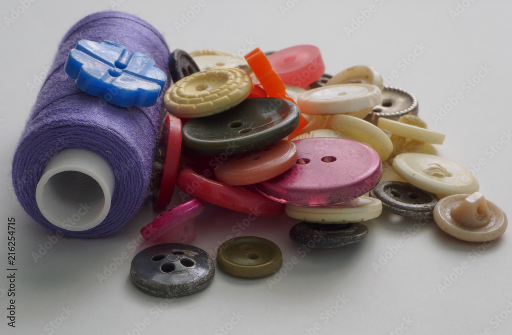 Multi-colored buttons purple threads Multi-colored buttons purple threads
