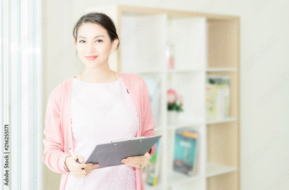 happy young woman working on laptop in workplace.entrepreneur working at start up.Business woman in office start-up working on laptop. happy young woman working on laptop in workplace.entrepreneur working at start up.Business woman in office start-up working on laptop.