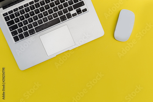 Laptop computer mouse bright yellow background