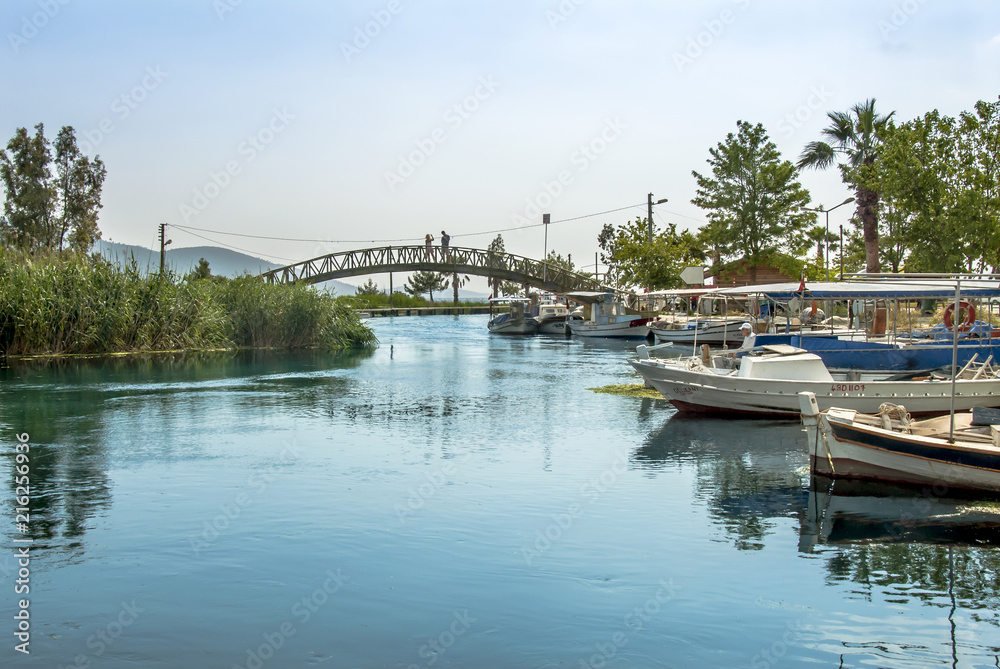 Mugla, Turkey, 14 May 2012: Bridge and Boats at Azmak Stream, Gokova Bay, Akyaka Mugla, Turkey, 14 May 2012: Bridge and Boats at Azmak Stream, Gokova Bay, Akyaka