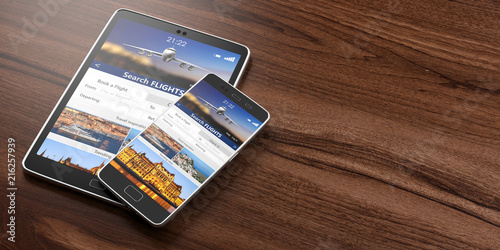 Smartphone and tablet on wooden backgound, Search flights on the screens, copy space. 3d illustration photo